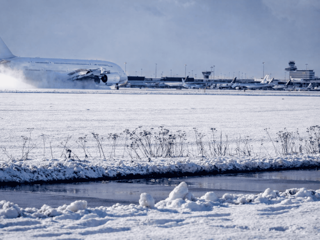 Snowy Schiphol with A380 taxiing